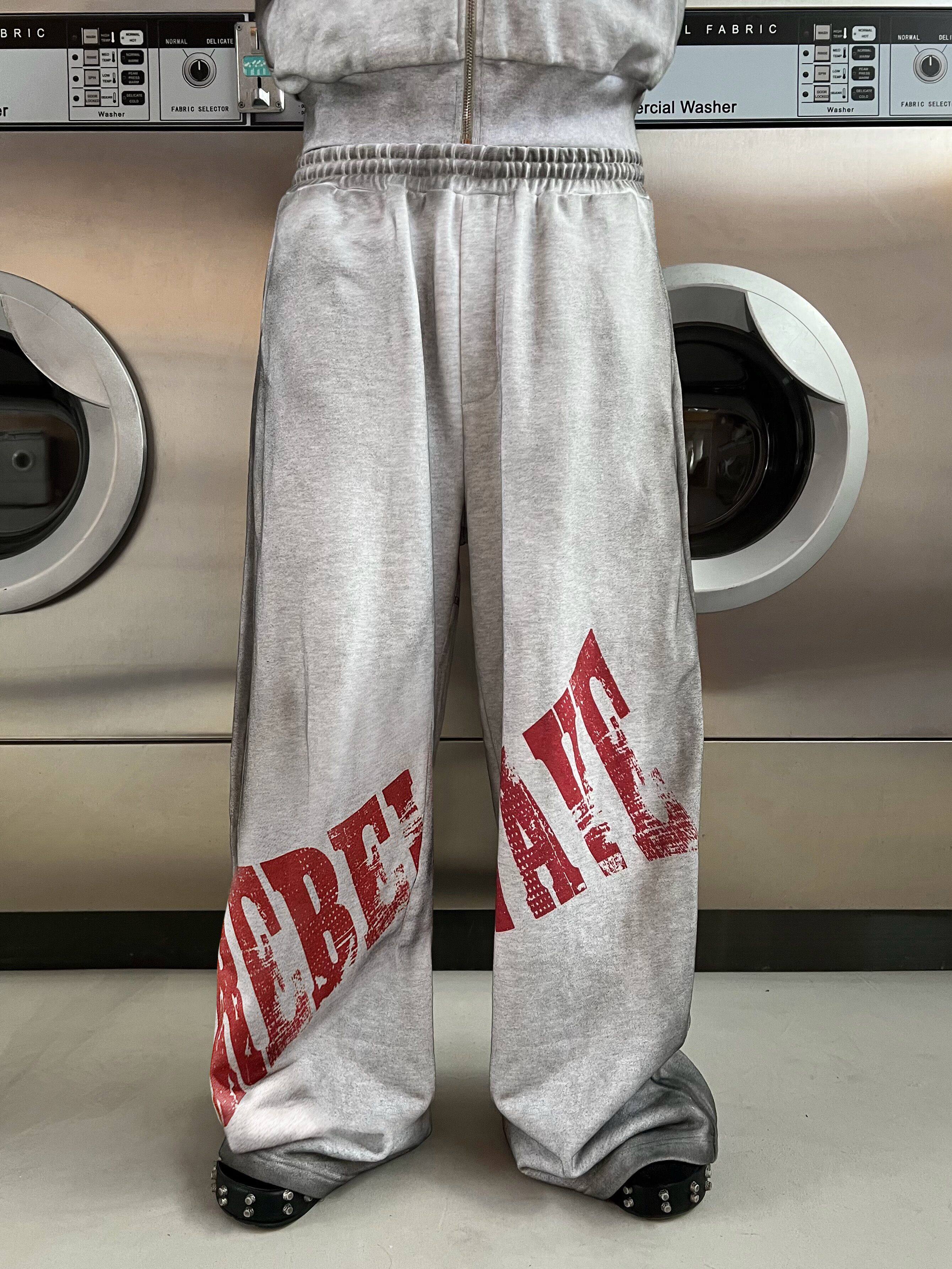 Distressed Reversible Slogan Sweatpants