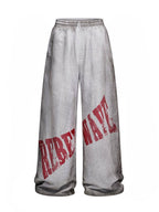 Distressed Reversible Slogan Sweatpants